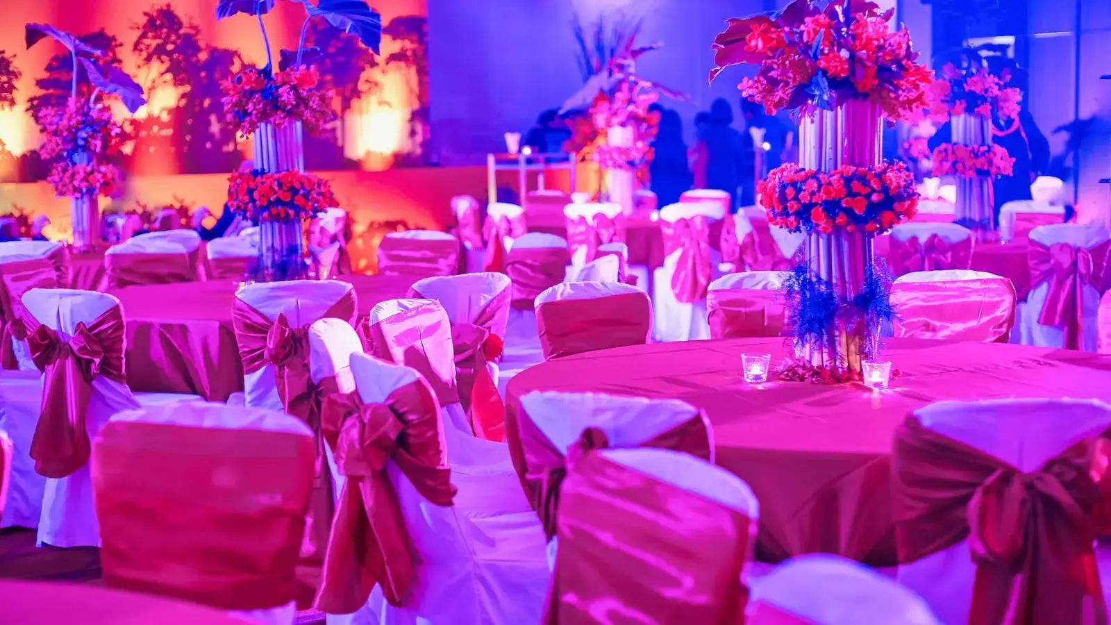tables and chairs decorated for wedding reception