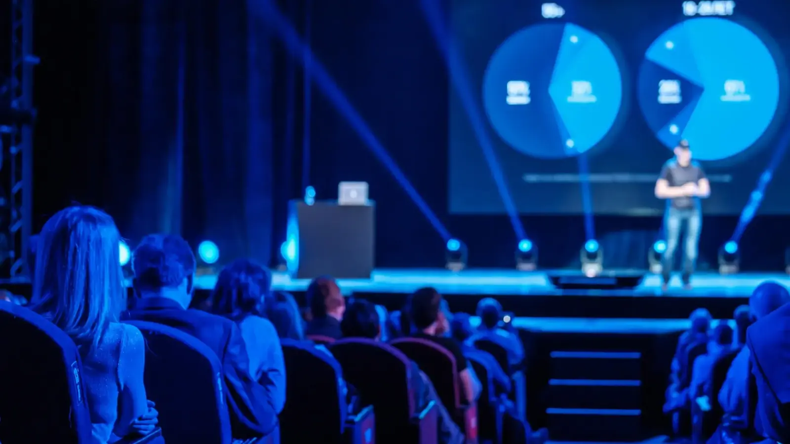 speaker giving presentation on stage