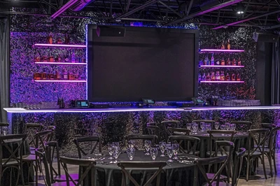 screen and tables at Aura Events Center